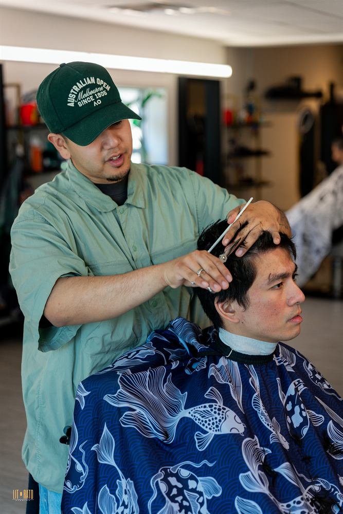 Barber detailing a client's haircut during the Dream Experience